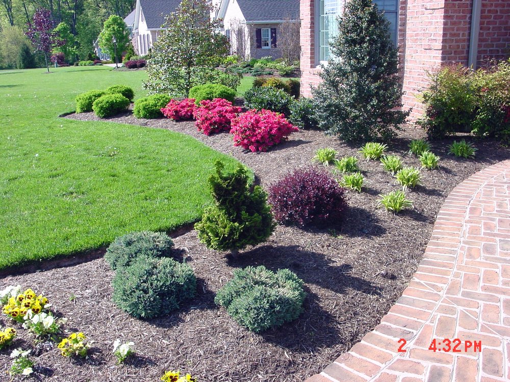 Beautifully striped residential lawn maintained by Elegant Landscaping in Erie, PA